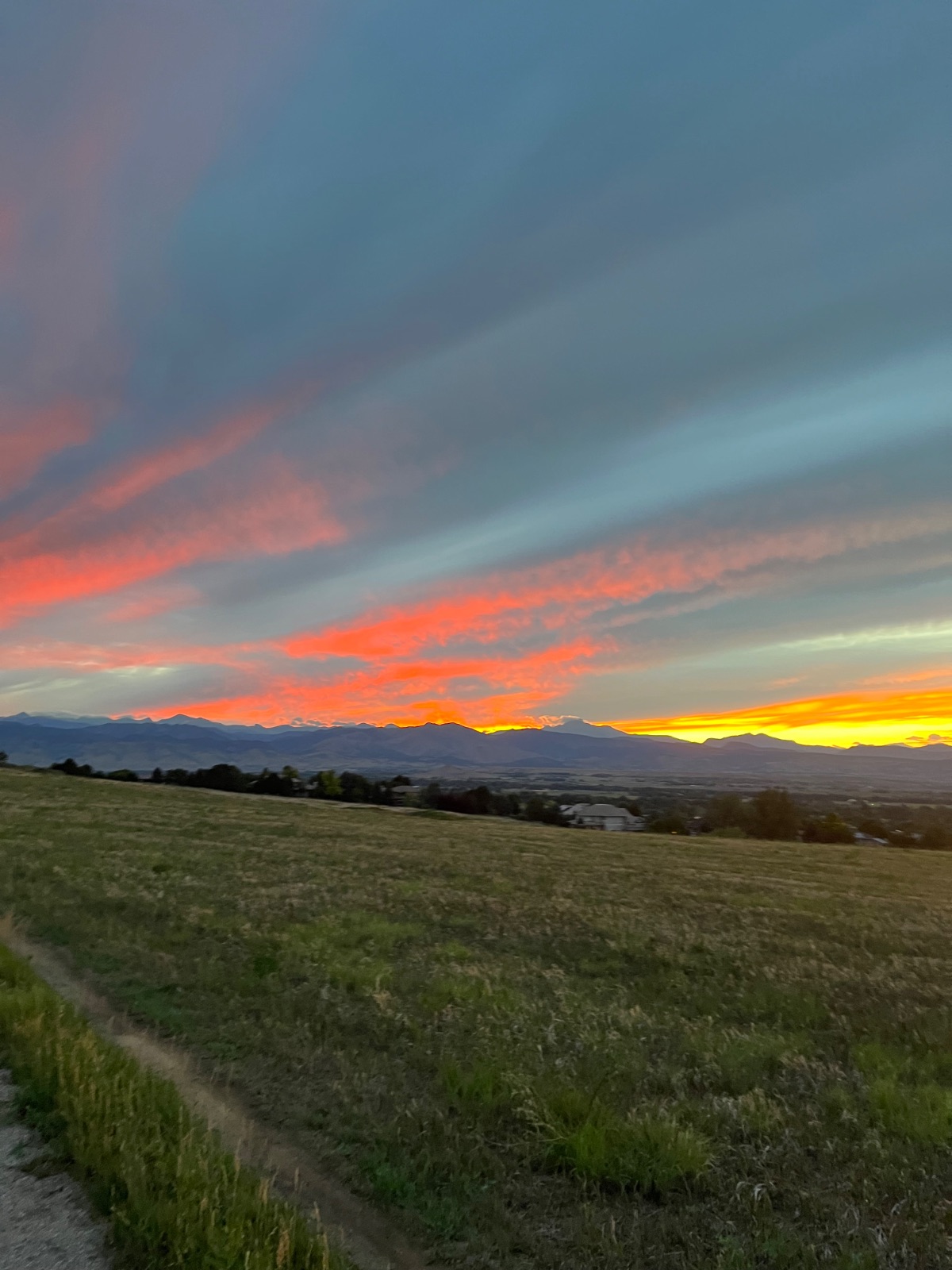 Sunset over the Front Range from a dirt trail on the grassland edge of Niwot